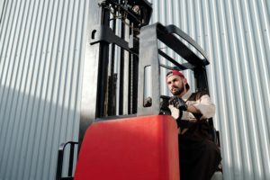 Man on forklift handling material