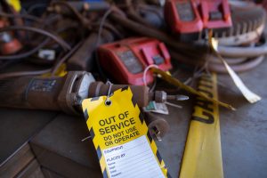 safety workplace with yellow out of service tag