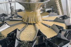 food in a factory flowing into a vessel ensuring material handling efficiency